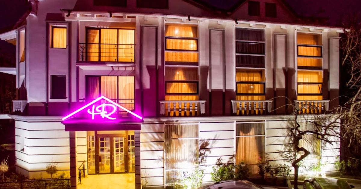 Boutique Romantic Focșani entrance, lit up in the evening